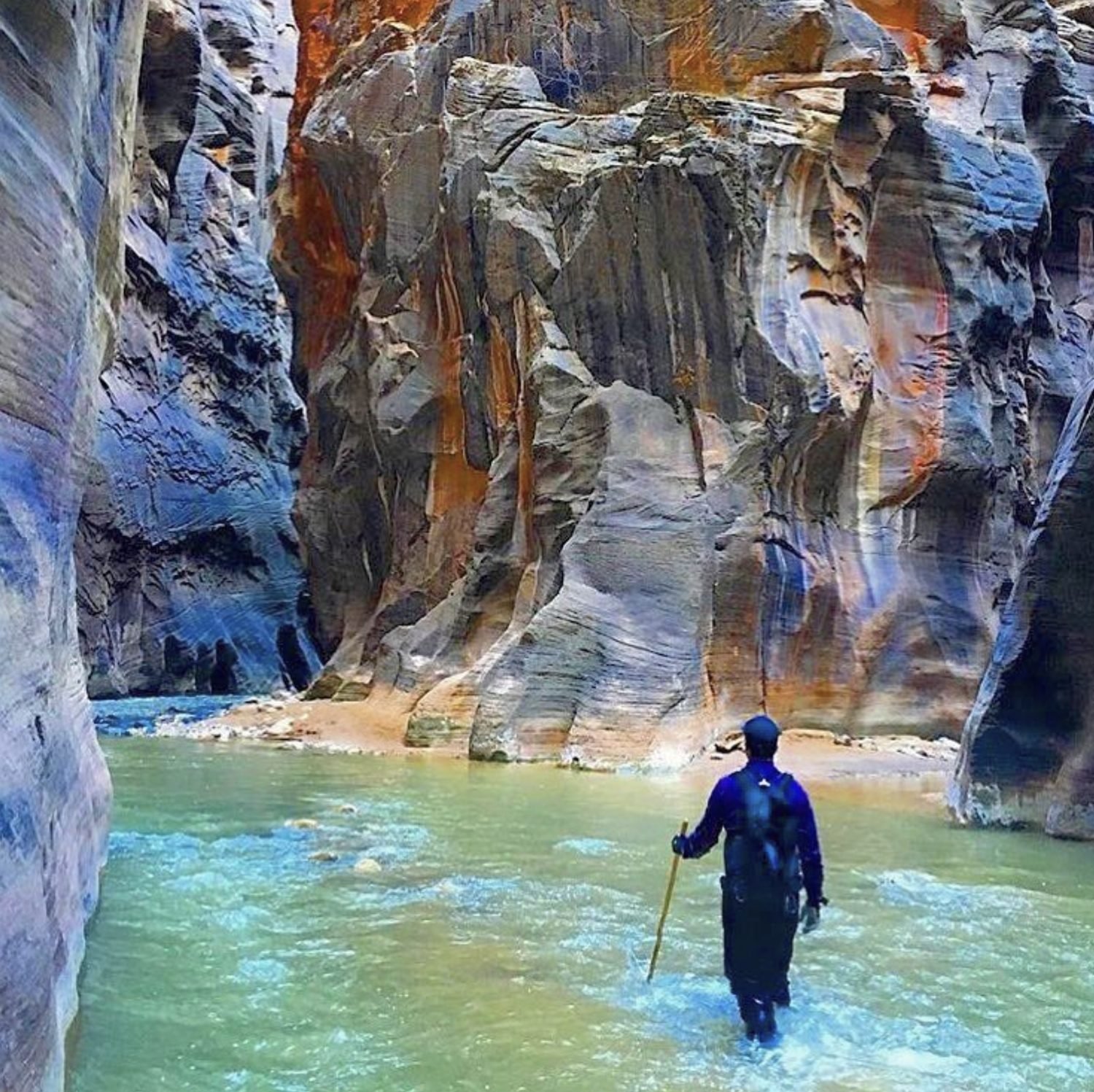 Wading a river through a slot canyon