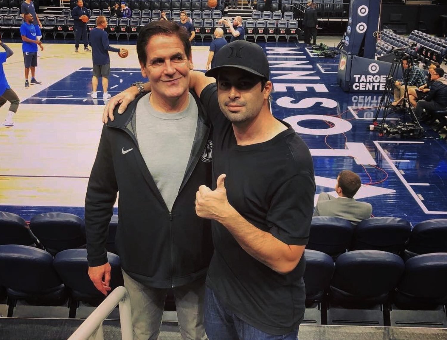 Chris Kirkman courtside at a basketball game during his design career