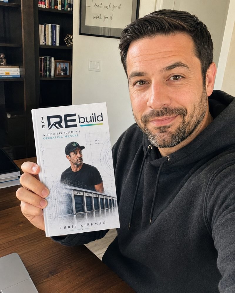 A reader taking a selfie with The REbuild in his library